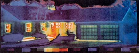 Not a pretty picture. Bright areas in this thermal photograph show where the home is losing heat.